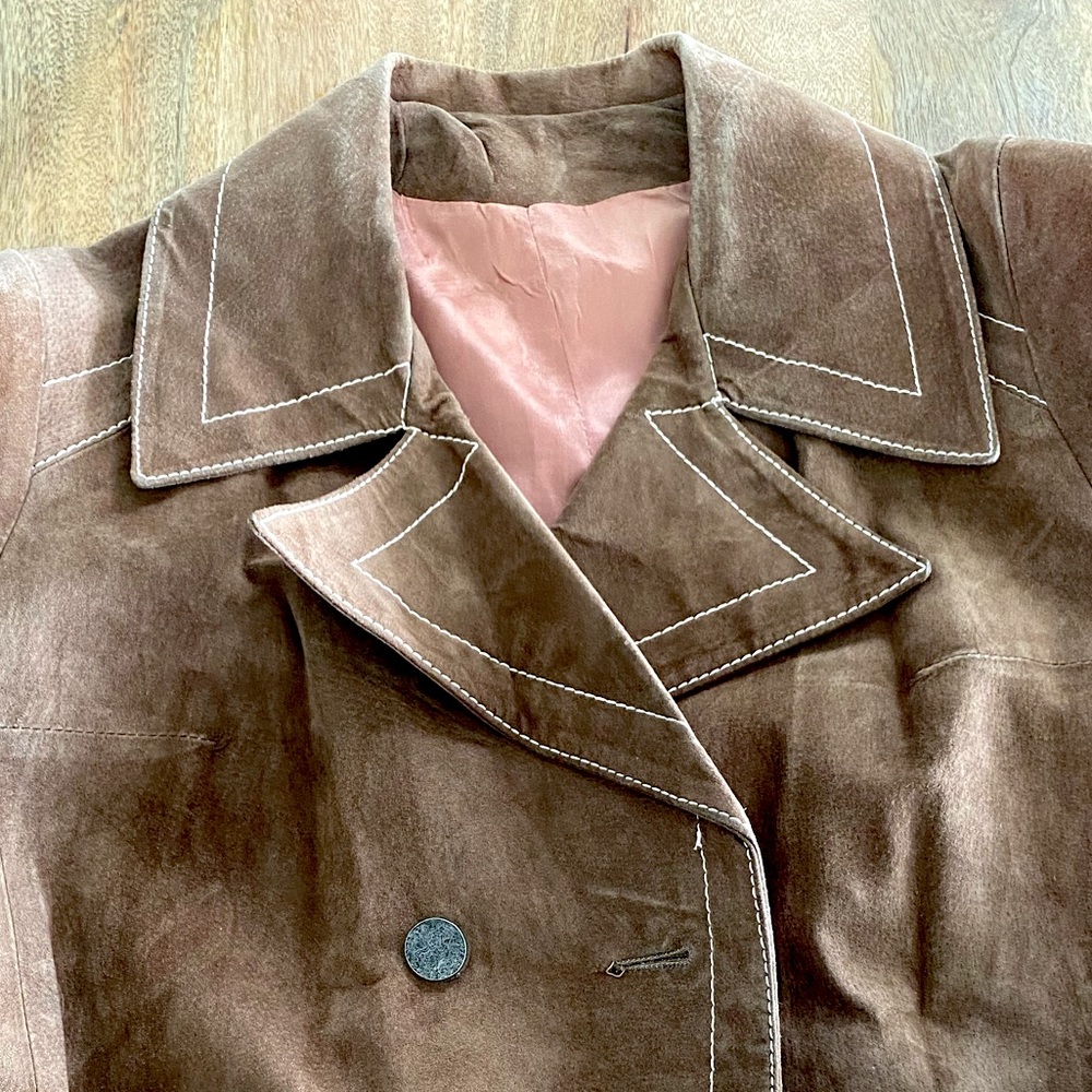 Vintage 70s light brown suede coat with white stitching and attached belt.